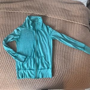 Medium zip-up workout jacket! A beautiful turquoise and lightly worn.